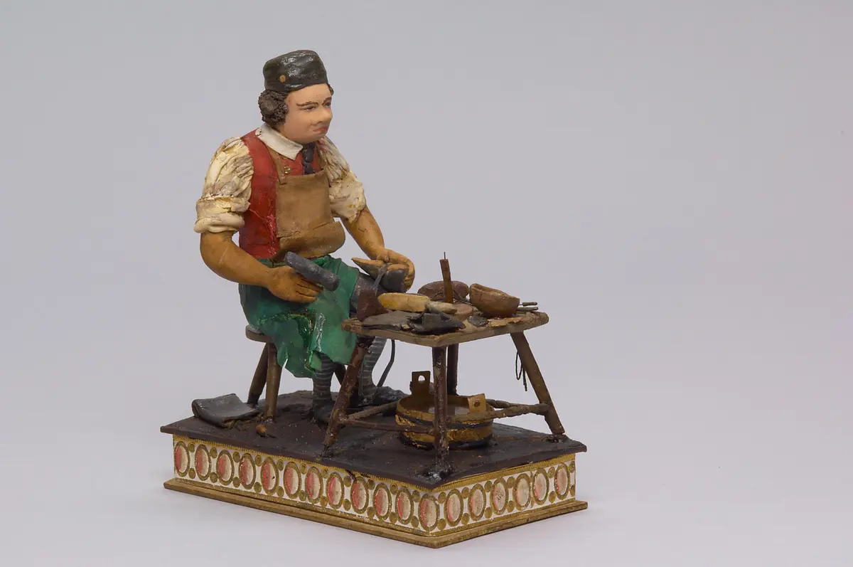 Dir. Carl Carl als Schuhmacher - Tragantfigur